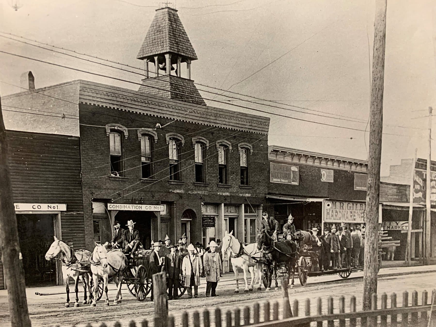 Denton firefighters and equipment outside an early fire station around 1914